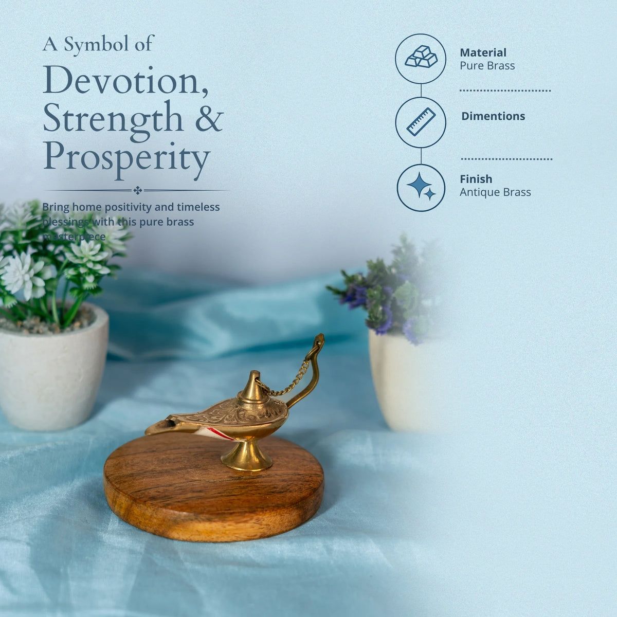 Brass Aladdin-style lamp on a wooden base with text that reads A Symbol of Devotion, Strength and Prosperity and material and finish details